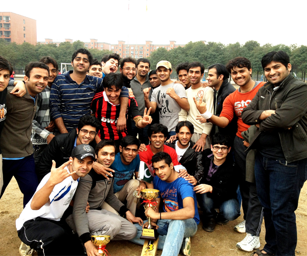 International Students celebrating with winning trophy